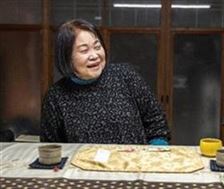 民宿の名前に込めた思いを語る美子さん
